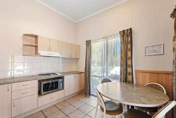 Kitchen inside a Deluxe 2-Bedroom Cabin at Discovery Parks Jindabyne.